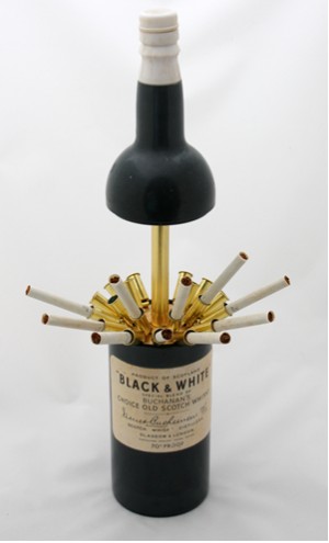 1960s musical cigarette dispensser in the shape of a Black and White whisky bottle, made in Japan