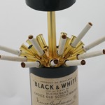 1960s musical cigarette dispensser in the shape of a Black and White whisky bottle, made in Japan