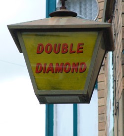 An ancient Double Diamond lantern outside the Royal Oak Hotel, Rhayader in 2006