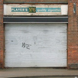 Players No6 sign over disused newsagents shop