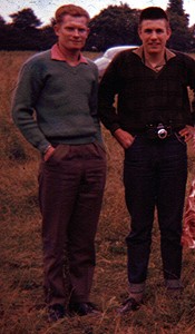 Two young men wearing casual clothes in the late 50s, jeans or casual trousers, casual shirts, and pullovers Two young men wearing casual clothes in the late 50s, jeans or casual trousers, casual shirts, and pullovers
