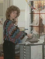 Office fashion, 80s style, batwing pullover and perm