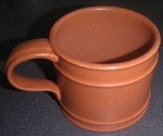 Portmeirion Meridan cup in terracotta (1971) (Image pottyforpots) Portmeirion Meridian cup in terracotta (1971) (Image pottyforpots)