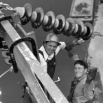 Linemen working for Seattle City Light in 1952, image by Seattle Municipal Archives licenced under Attribution 2.0 Generic (CC BY 2.0) (cropped)